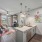 kitchen counter with sink open to living room