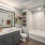 well lit bathroom with shower/tub combo