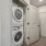stacked washer/dryer units in laundry closet